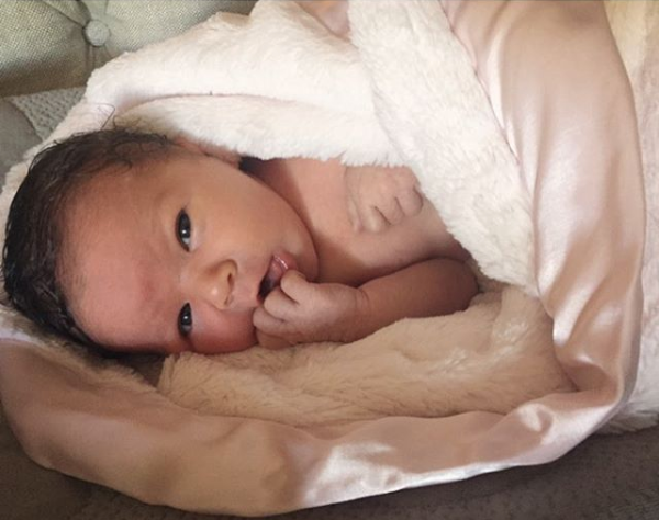 Lacey Chabert's baby wrapped in a Little Giraffe blanket