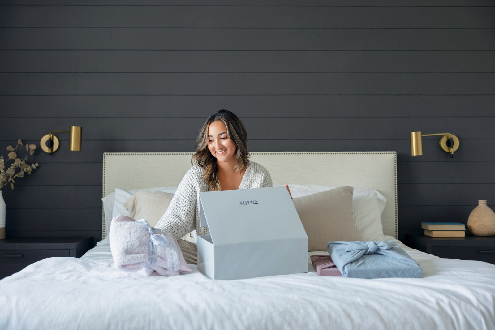 Mom unwrapping mother's day gift